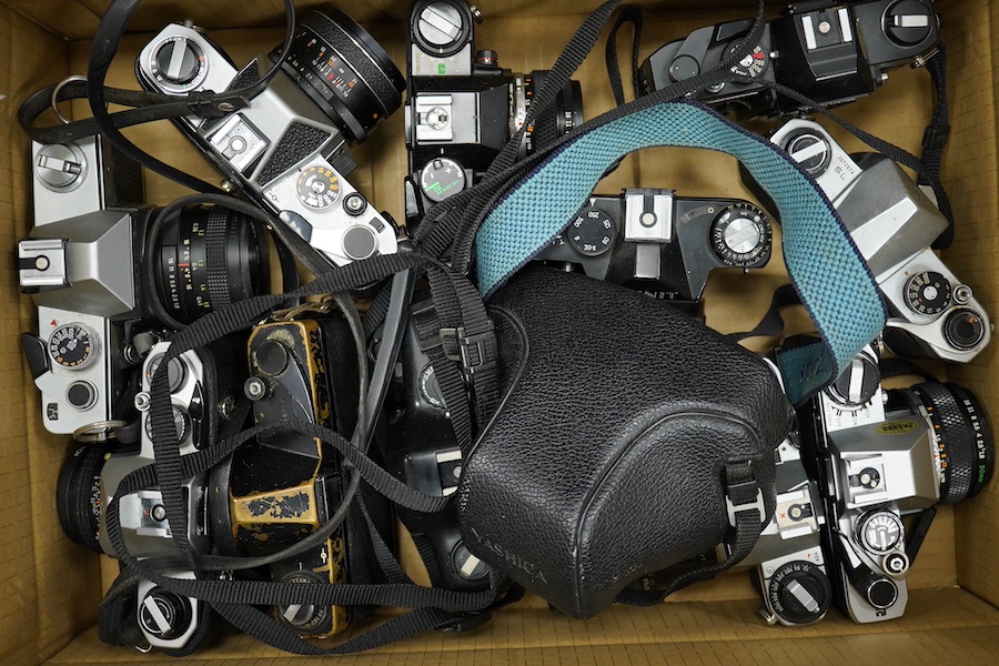 Sixteen SLR camera bodies by Nikon, Olympus, Praktica, Pentax, etc., together with six lenses including Canon and other accessories including camera cases, etc. Condition - poor to fair.